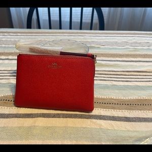 A coach wristlet red leather